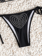 Bikini negro con corazón de diamantes