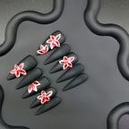 Uñas postizas negras mate con flores 3D