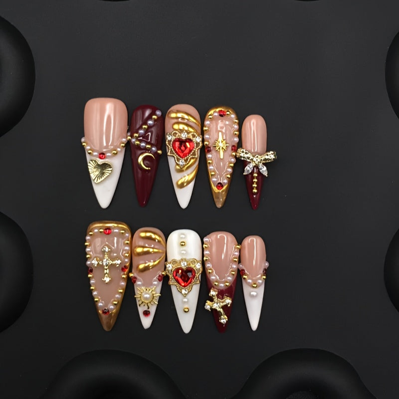 Uñas postizas con lazos y coronas doradas