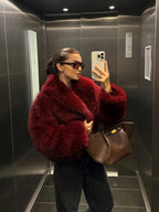 Abrigo sintético con cuello alto y botones